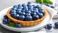 Delicious blueberry tart on plate, closeup Royalty Free Stock Photo