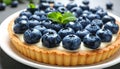Delicious blueberry tart on plate, closeup Royalty Free Stock Photo