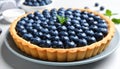 Delicious blueberry tart on plate, closeup Royalty Free Stock Photo