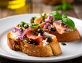 Italian bruschetta with chopped onion, fish, capers and balsamic vinegar Royalty Free Stock Photo
