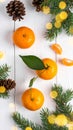 Fresh tangerines, fir branches and cones on a white wooden table, flat. Bokeh lights Royalty Free Stock Photo