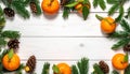 Fresh tangerines, fir branches and cones on a white wooden table, flat. Bokeh lights Royalty Free Stock Photo
