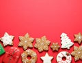 Different tasty Christmas cookies on red background, flat lay. Space for text Royalty Free Stock Photo