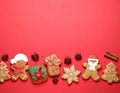 Different tasty Christmas cookies on red background, flat lay. Space for text Royalty Free Stock Photo