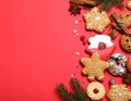 Different tasty Christmas cookies on red background, flat lay. Space for text Royalty Free Stock Photo