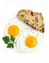 Tasty fried eggs with bread and parsley isolated on white Royalty Free Stock Photo