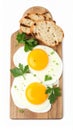 Tasty fried eggs with bread and parsley isolated on white Royalty Free Stock Photo