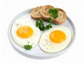 Tasty fried eggs with bread and parsley isolated on white Royalty Free Stock Photo