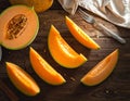 Cut a ripe melon on a wooden table, flatly. Text area Royalty Free Stock Photo