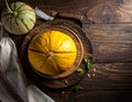 Cut a ripe melon on a wooden table, flatly. Text area Royalty Free Stock Photo