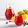 Glasses and jug of Red Sangria on white wooden table Royalty Free Stock Photo