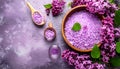 Sea salt spa set with pink lilac flowers. Top view Royalty Free Stock Photo