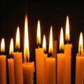 Burning wax candles on black background, closeup Royalty Free Stock Photo