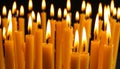 Burning wax candles on black background, closeup Royalty Free Stock Photo