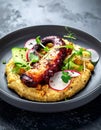 Served over creamy peppery chickpeas with fried octopus, crispy cucumber and radish Royalty Free Stock Photo
