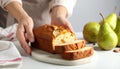 Woman with slice of pear bread at white marble table, closeup. Homemade cake Royalty Free Stock Photo