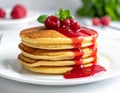 Delicious Pancake Cake on a White Plate with Fruit Sauce Royalty Free Stock Photo