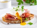Toast with ham, mustard and poached egg Royalty Free Stock Photo