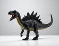 A Toy Dinosaur with a Black Skin Tone and a Spiky Back Royalty Free Stock Photo
