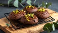 Chocolate pudding cookies with pistachio topping served on a wooden board and decorat Royalty Free Stock Photo