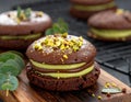 Chocolate pudding cookies with pistachio topping served on a wooden board and decorat Royalty Free Stock Photo