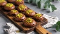 Chocolate pudding cookies with pistachio topping served on a wooden board and decorat Royalty Free Stock Photo