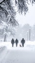 After a night of snow blizzard foggy morning silhouettes of passers citizens walking Royalty Free Stock Photo