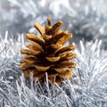 Christmas tree with a pinecone in tinsel Royalty Free Stock Photo