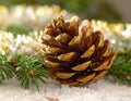 Christmas tree with a pinecone in tinsel Royalty Free Stock Photo