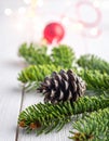 Christmas tree with a pinecone in tinsel Royalty Free Stock Photo