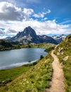 Taking in the view of Midi d\'Ossau beyond Lac Gentau beside the GR10 trekking route Royalty Free Stock Photo