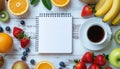top view flat lay of healthy breakfast with coffee, various fresh fruits, and blank notebook for diet plan Royalty Free Stock Photo