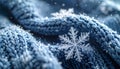 Macro snowflake on cozy blue knitted wool. Winter Christmas background with falling snow and ice crystals. Royalty Free Stock Photo
