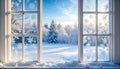 Winter window with frost snowflakes looking out at a sunny snowy landscape. Cozy Christmas morning view with snow. Royalty Free Stock Photo