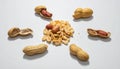Assorted Peanuts and Shells on White Background Royalty Free Stock Photo