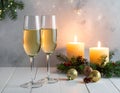 Champagne For Christmas Celebration - Flutes With Candle Decoration Royalty Free Stock Photo