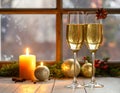 Champagne For Christmas Celebration - Flutes With Candle Decoration Royalty Free Stock Photo