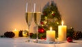 Champagne For Christmas Celebration - Flutes With Candle Decoration Royalty Free Stock Photo