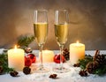 Champagne For Christmas Celebration - Flutes With Candle Decoration Royalty Free Stock Photo