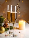 Champagne For Christmas Celebration - Flutes With Candle Decoration Royalty Free Stock Photo