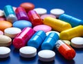 Colorful pills closeup on dark blue background Royalty Free Stock Photo