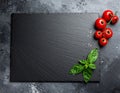 Mock-up for food bars cafes restaurant pizzerias with slate and tomato Royalty Free Stock Photo
