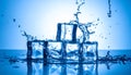 Ice cubes and splashing water on blue gradient background Royalty Free Stock Photo
