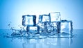 Ice cubes and splashing water on blue gradient background Royalty Free Stock Photo
