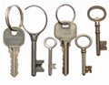 An assortment of six keys is displayed against a white background Royalty Free Stock Photo