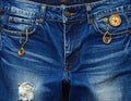Close-up of a pair of faded blue denim jeans featuring decorative elements Royalty Free Stock Photo