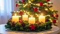 Christmas advent wreath with burning candles. Lights on x-mas tree in background Royalty Free Stock Photo