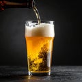Closeup pour light ale beer in pint glass over black background Royalty Free Stock Photo
