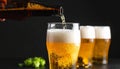 Closeup pour light ale beer in pint glass over black background Royalty Free Stock Photo