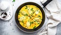 Frying pan with scrambled eggs stuffed with edible yucca flowers.Diet omelet Royalty Free Stock Photo